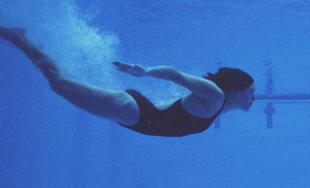 image of girl swimming under water