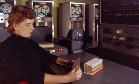 Women looking at computer code cards