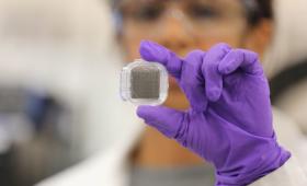 Swetha Chandrasekaran holds 3D-printed graphene aerogel supercapacitor