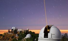 The Lick Observatory’s Laser Guide Star forms a beam of glowing atmospheric sodium ions.