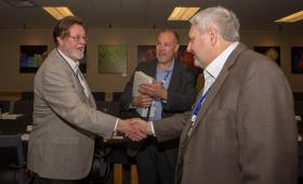 Lawrence Livermore National Laboratory Director Bill Goldstein (right) shakes hands with San Francisco 49ers chairman John York 