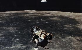 Apollo 11 moon lander, moon in background, earth on horizon