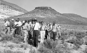 B&W photo of men walking at Nevada Test Site