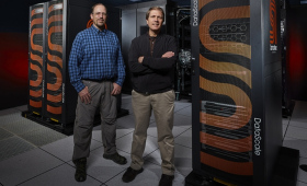 LLNL Informatics Group Leader Brian Van Essen (left) and Bronis R. de Supinski, Chief Technology Officer for Livermore Computing, stand by the new SambaNova artificial intelligence hardware in the Livermore Computing Center