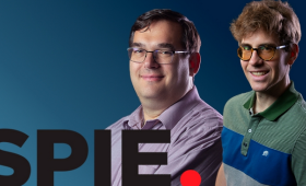 Photo of Wren Carr and Peter DeVore with SPIE logo