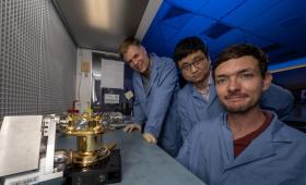 LLNL team members look over a prototype of the gamma-ray spectrometer