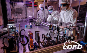 From left: Drew Willard, Brendan Reagan and Issa Tamer work on the Big Aperture Thulium (BAT) laser system.