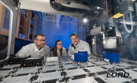 From left: chemists Brian Mayer and Katelyn Mason and biologist Todd Corzett observe the operation of the robot that independently executes the acetylchlolinersterase assays the team uses to assess Novichok inhibition and to discover new oxime antidotes for Novichok poisoning.