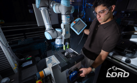 The Autonomous Alloy Prediction and EXperimentation (APEX) platform aims to accelerate the alloy-discovery process by leveraging robotics and machine learning to design, build and test samples without human intervention. LLNL robotics and materials engineering intern Andre Fatehi monitors the APEX platform during an experimental test run.