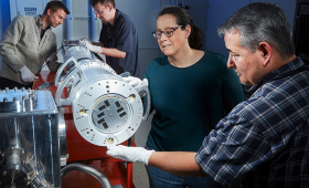 Four LLNL technologies received 2025 R&D 100 awards, including the FIDDLE diagnostic. Peter Nyholm, Andrew Sharp, Robin Benedetti and Brandon Morioka (from left) make adjustments in the FIDDLE diagnostic, which can produce multiple images of phase transitions in materials over a few nanoseconds. 