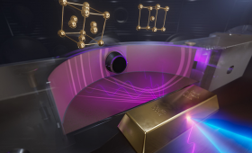 Artist’s illustration of gold compressed to ultra-high pressures by laser pulses at the National Ignition Facility. X-rays scatter from the sample, producing diffraction patterns that reveal how its atomic structure changes under extreme compression. 
