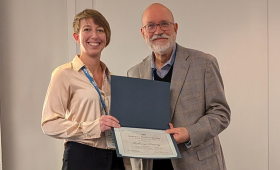 LLNL’s Rebecca Toomey (left) has been recognized with the Division of Nuclear Physics’ Distinguished Service Award, presented by Jim Napolitano (right), the current chair of the division.
