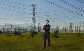 Caspar Donnison standing in fron of powerlines in Livermore, CA