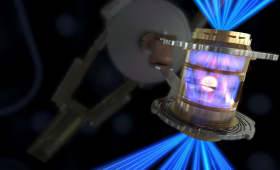 In an inertial confinement experiment on the National Ignition Facility, the lasers converge at tiny entrance holes at the top and bottom of the hohlraum. The intersection of the lasers enables crossed-beam energy transfer, an important factor in maintaining symmetry of implosions. 